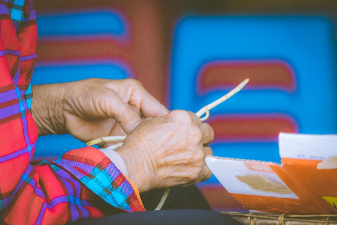 A woman is holding a pair of scissors in her hands